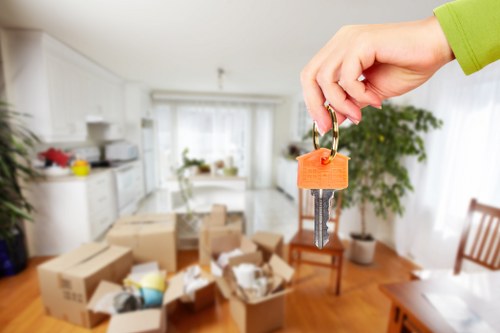A mover transporting compact household items during a Wallington relocation